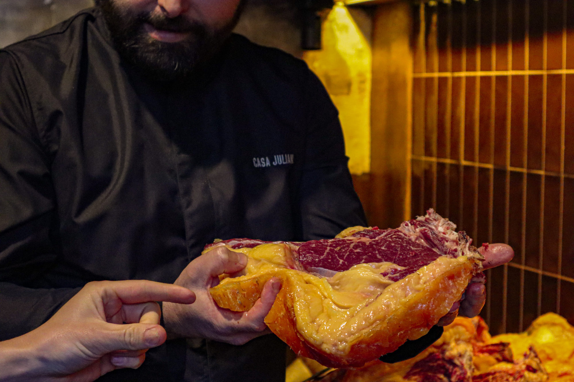 Chef presenting steak at Casa Julian
