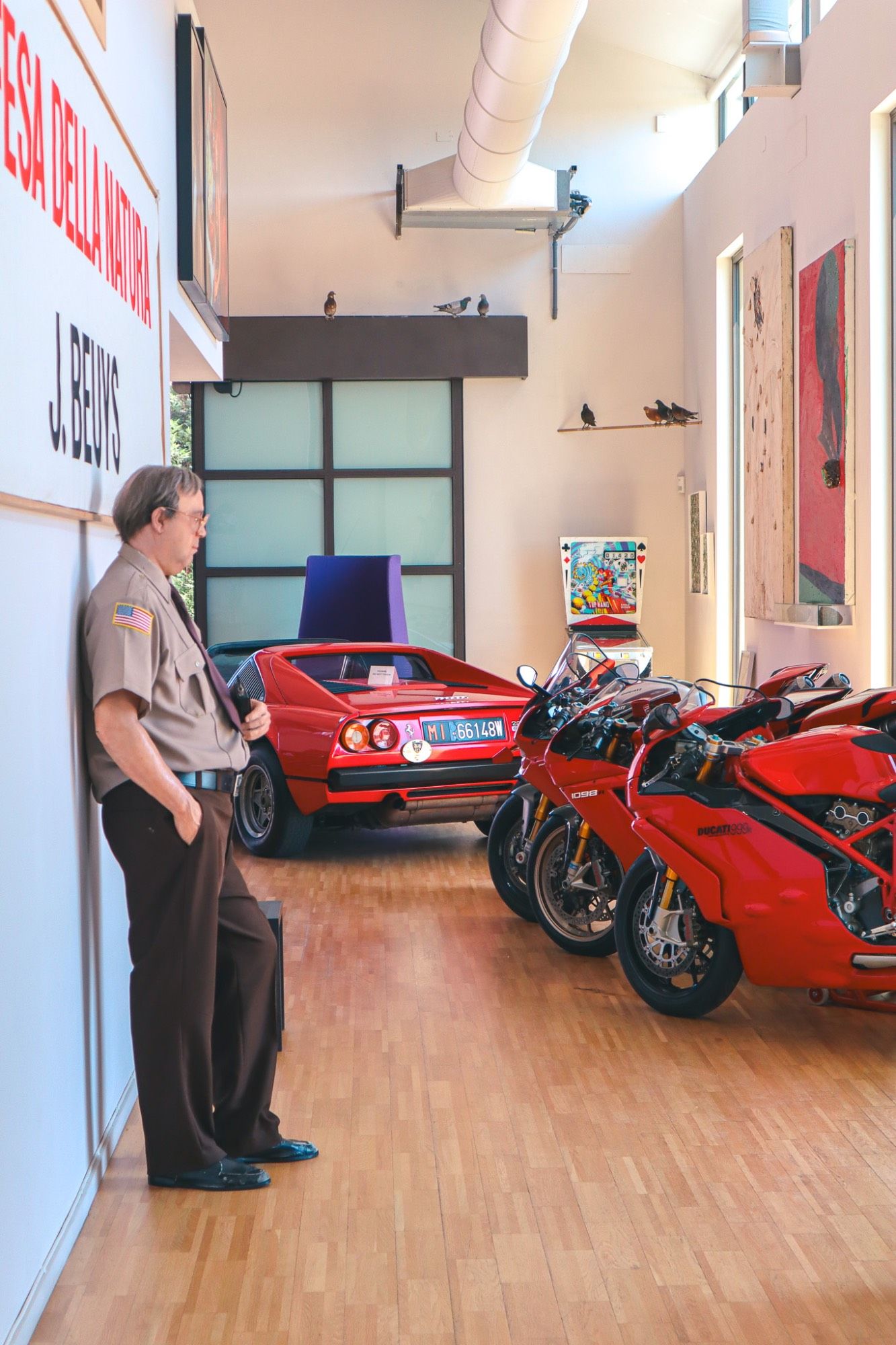 Gallery with vintage Ferrari and Ducati motorcycles