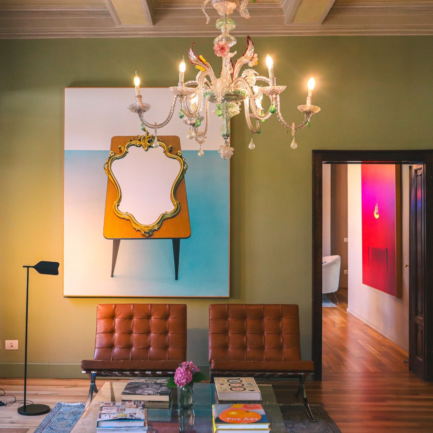 Living room with chandelier and framed art