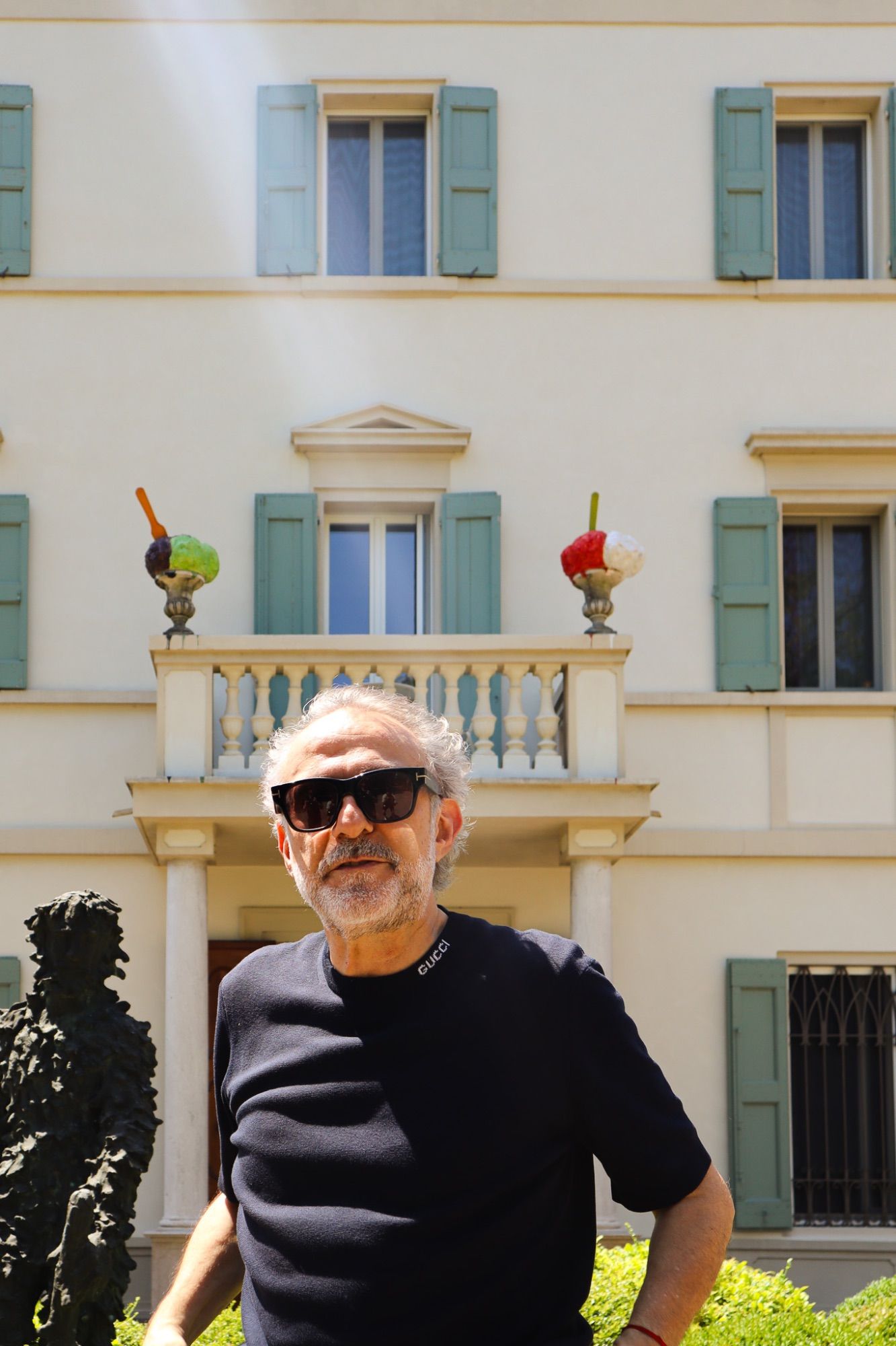 Portrait in front of an Italian villa with sculptures