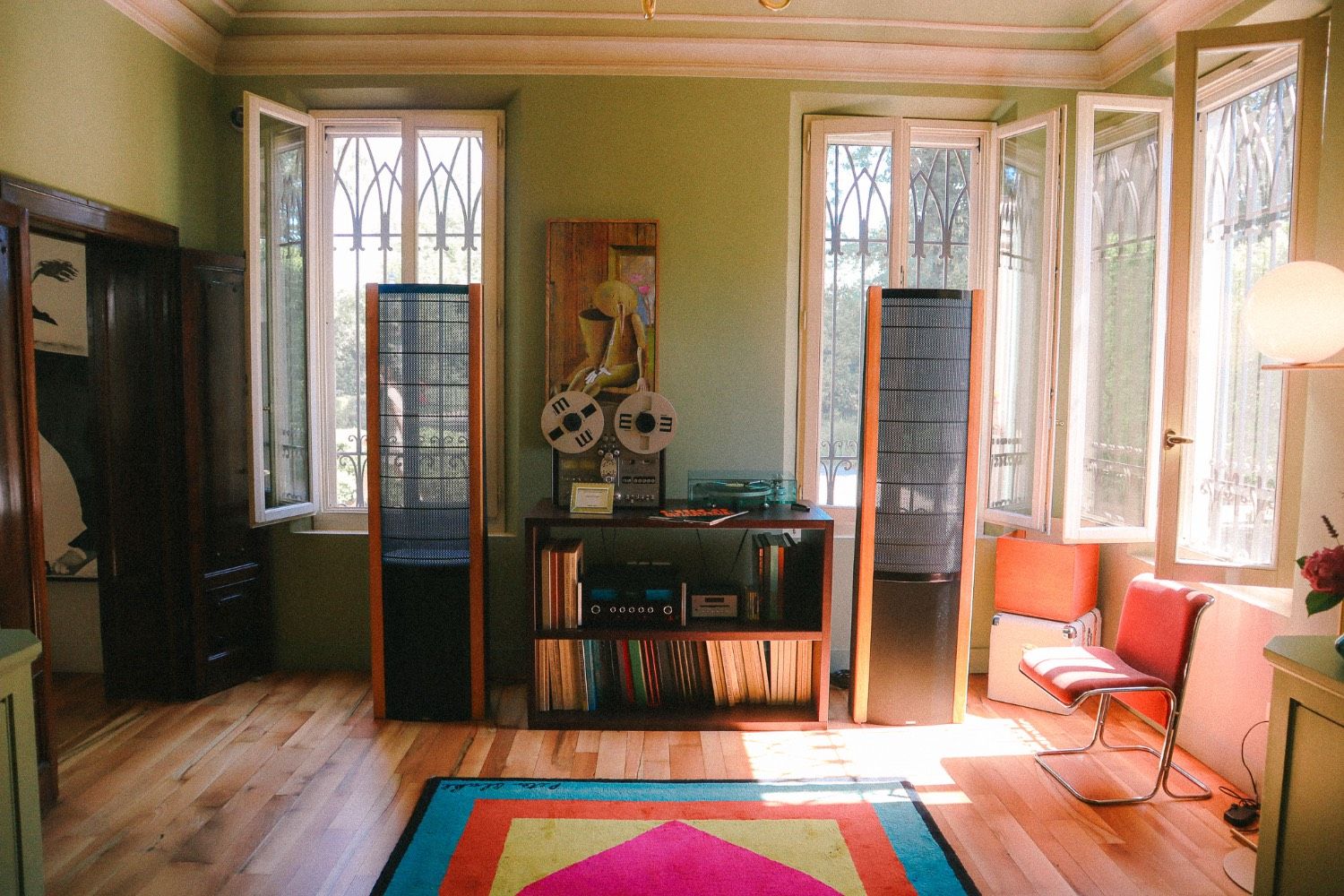 Room with vintage stereo speakers and reel-to-reel player